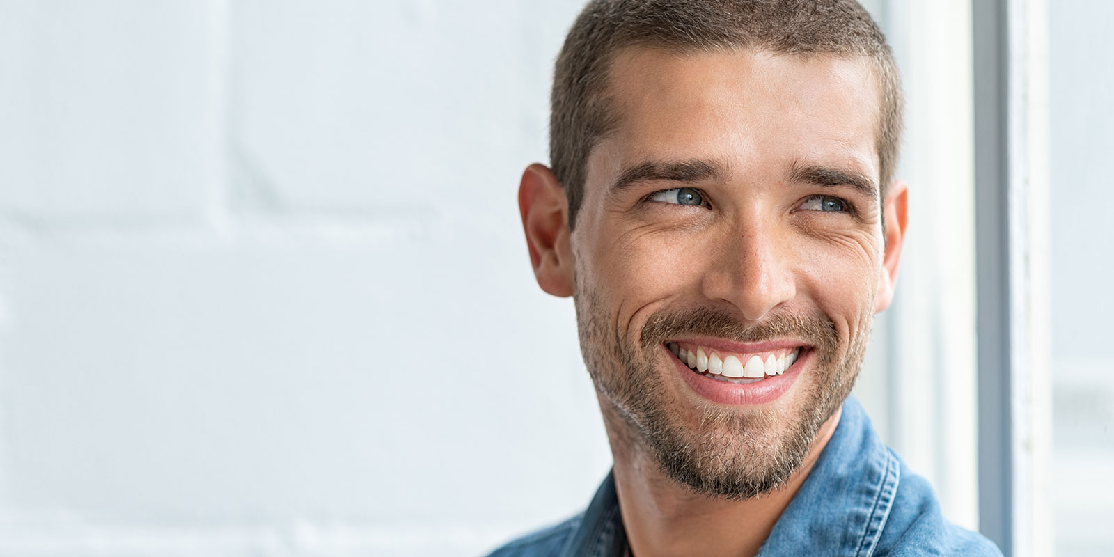 man smiling after the dentist