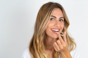woman with clear aligners