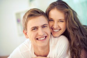 man and woman smiling