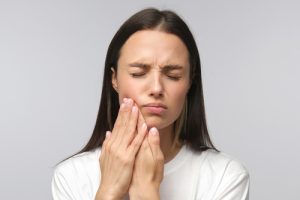 woman with jaw pain